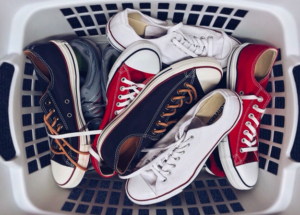 laundry basket full of sneakers